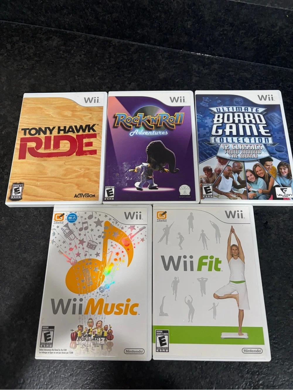 Nintendo Wii Game Bundle - White, Purple, Orange, Blue
